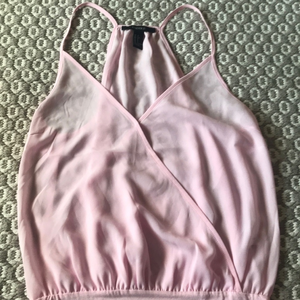 Baby pink body suit.